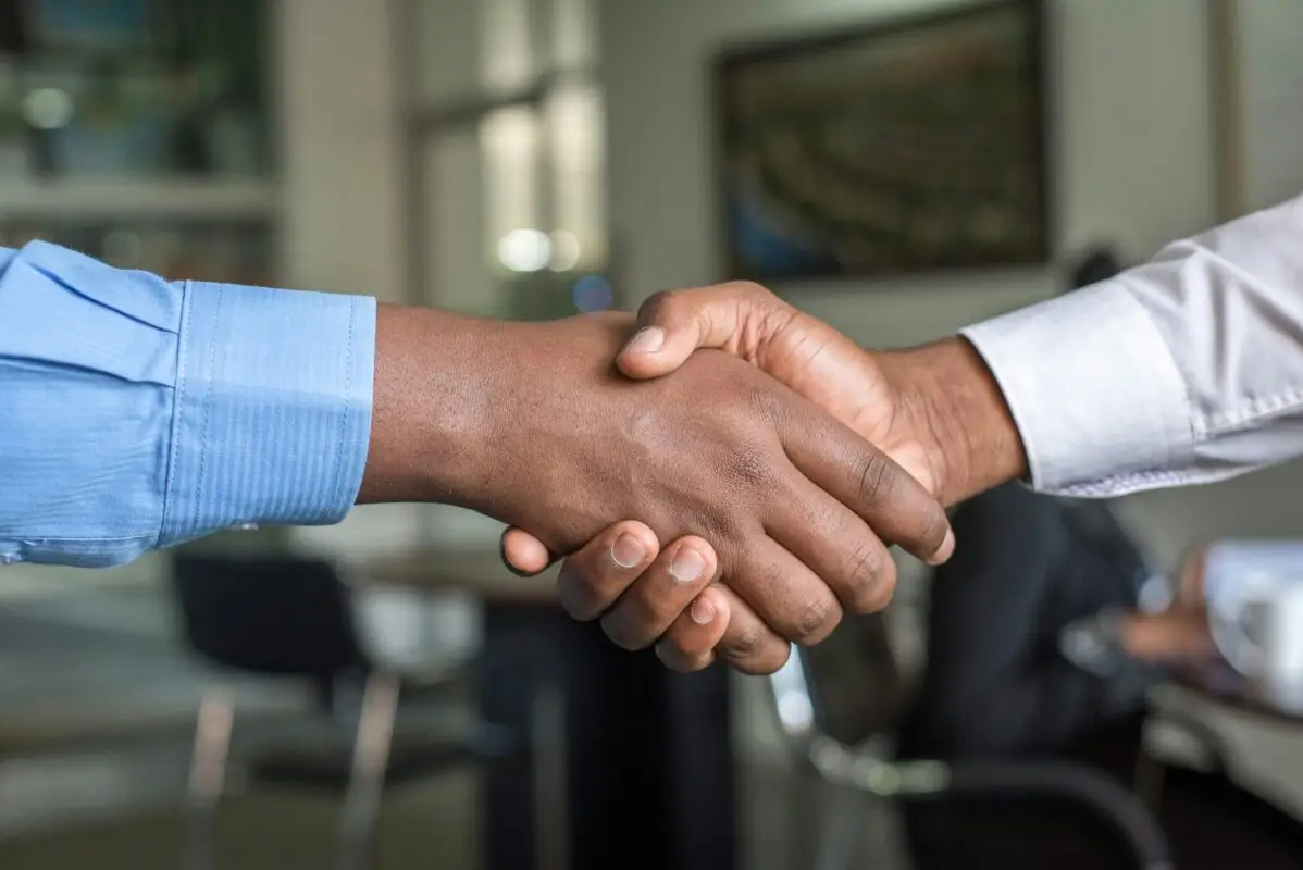 executive sales leader hiring meeting handshake